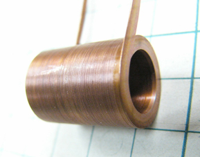 A thin (0.2 mm) and wide (2.5 mm) edgewise coil (wound upright). 