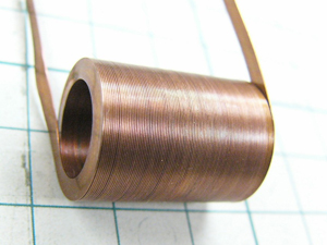 A thin (0.2 mm) and wide (2.5 mm) edgewise coil (wound upright). 
