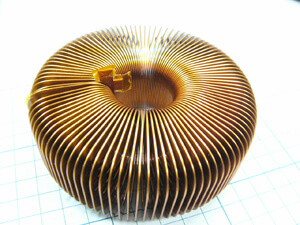 Why not try a high laminating factor with a toroidal coil?