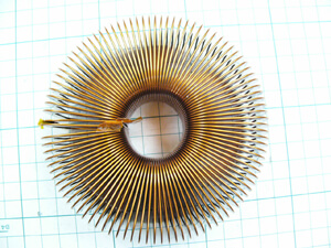 Why not try a high laminating factor with a toroidal coil?