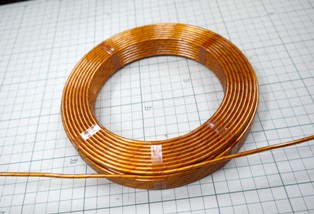 A coil in a copper tube like a pipe(tube) insulated with Kapton, etc.!!